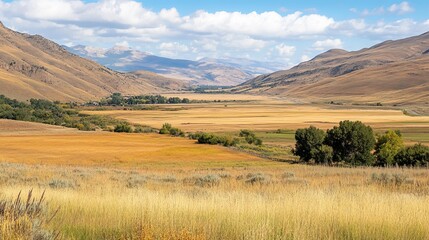 Golden valley landscape, mountains, and clouds
