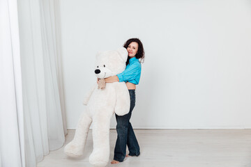 woman in jeans with a polar bear gift