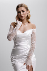 An Elegant Bride wearing a stunning Lace OffShoulder Wedding Dress, radiating beauty and charm