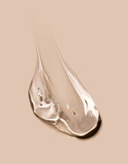 cosmetic texture gel essence smears on a beige background