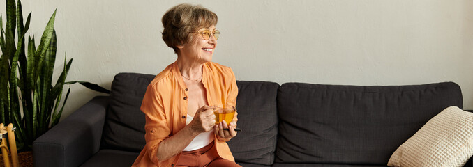 Warm and joyful moments of a senior woman enjoying tea in her cozy home space