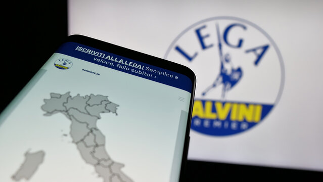 Stuttgart, Germany - 07-17-2025: Mobile phone with website of Italian party Lega per Salvini Premier (LSP) on screen in front of logo. Focus on top-left of phone display.