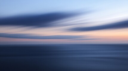 Fototapeta premium Blurry sunset over calm water