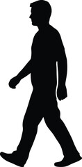 A silhouette of a man walking 