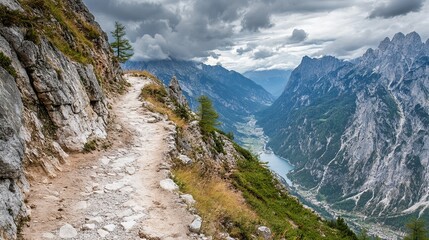 Mountain path winds through dramatic alpine scenery