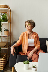 Mature woman relaxing in comfy attire surrounded by home greenery and cozy ambiance