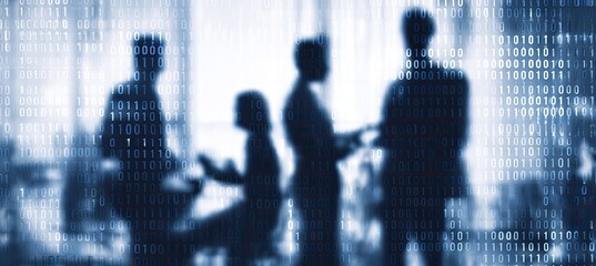 Silhouette of people in a room with binary code