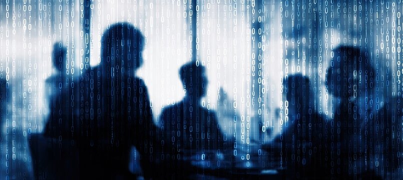 Silhouettes of people in a meeting, overlaid with binary code - Powered by Adobe