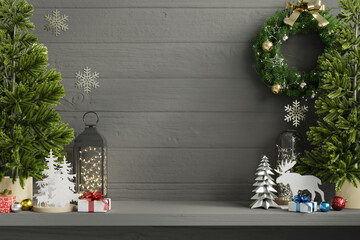 Christmas decorations and ornaments displayed on a wooden shelf, ideal for festive holiday...