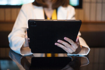 Businessman using on smartphone and tablet and laptop at office