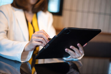 Businessman using on smartphone and tablet and laptop at office