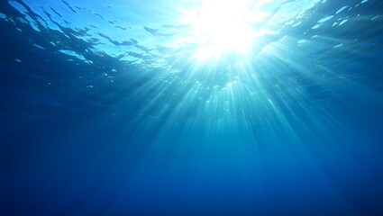 Underwater ocean sun rays deep blue sea sunlight beams marine life clear water view