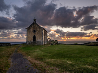 Fototapeta premium The Hermitage of Santa Catalina de Mundaka (Navarra, Spain) at dawn