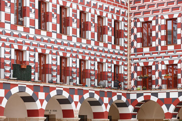 Picturesque multicolored facade in Plaza Alta. Casas Coloradas. Badajoz, Spain