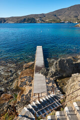 Wooden pathway to the Mediterranean sea. Costa Brava, Girona, Spain