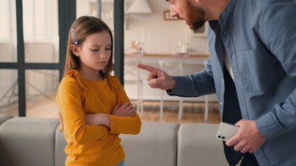 Irritated Caucasian father man parent scolding talk guilty device addicted little child girl...