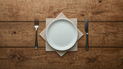 Elegant table setting with white plate and cutlery