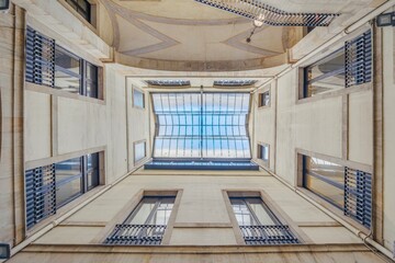 Obraz premium Upward View Of Ateneu Barcelones Courtyard Sky-Light. Historic Architecture, Geometric Design, Urban Interior and cultural institution promotion.