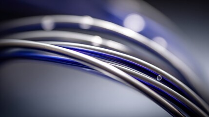 Obraz premium Close-up of curved, metallic tubes with blue accents