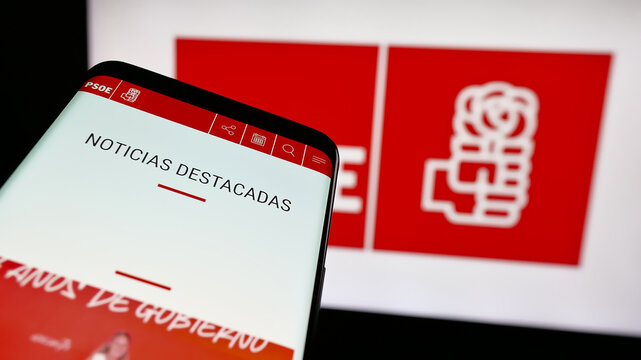 Stuttgart, Germany - 07-18-2025: Mobile phone with website of Partido Socialista Obrero Espa&ntilde;ol (PSOE) on screen in front of logo. Focus on top-left of phone display.