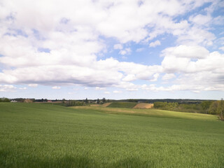 Green fields and hills in Wiezyca, Kashubian Region, Poland.