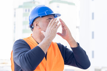Tired and exhausted mechanical technician or building contractor. Bad news triggering headache