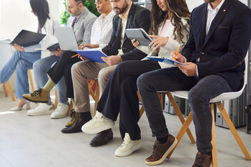 Business people team sits in row, working during office meeting or conference, enhancing...