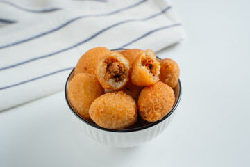 Combro is a typical Sundanese fried food. Combro is made from grated cassava which is shaped round or oval and filled with oncom and chili sauce and then fried.
