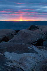 Sunset over the Atlantic Ocean at Peggy's Cove in Halifax, Nova Scotia, Canada.