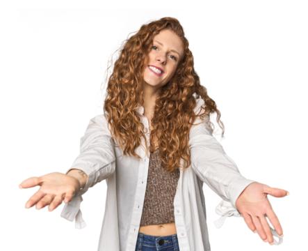Simple redhead studio portrait showing a welcome expression.