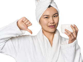 Chinese woman with moisturizer in robe feels proud and self confident, example to follow.
