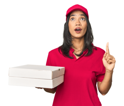 Latina delivering pizza, studio setup pointing upside with opened mouth.