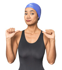 Pro Latina swimmer in studio gear feels proud and self confident, example to follow.