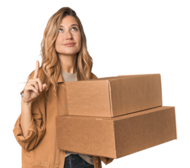 Blonde Caucasian moving with large boxes pointing upside with opened mouth.