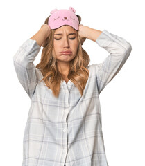 Blonde pretending to sleep in cozy pajamas