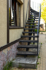 black stairs outside the building leading up
