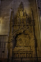 Gothic tomb of Bishop Alonso de Cartagena in ornate stone altarpiece