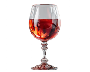 A wine glass is filled with red wine