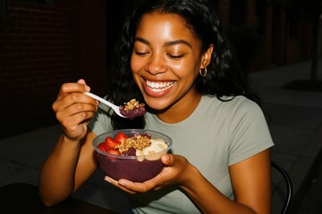 Joyful woman enjoying acai bowl.
