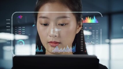 Woman using transparent screen technology with data and graphs overlayed on the display panel screen - Powered by Adobe