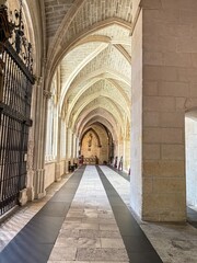 Upper cloister of Burgos Cathedral with pointed vaults and stained glass