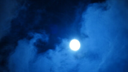 The moon night view with the round and white moon in the sky