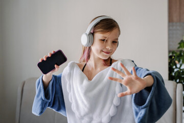 Happy girl enjoying music with headphones
