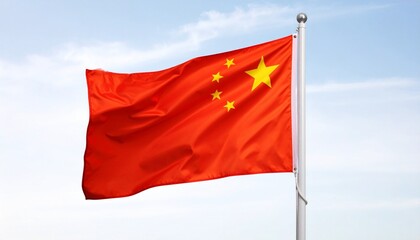 Chinese flag with red field and five yellow stars in top hoist corner—one large star and four smaller stars forming arc—fluttering on white flagpole against bright sky.