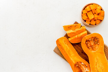 Pumpkin - slices on cutting board - on white background top-down space for text
