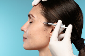 Close-up of Woman Receiving Cosmetic Injection on Face