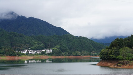 The beautiful mountains landscapes with the green forest and little village as background in the countryside of the China