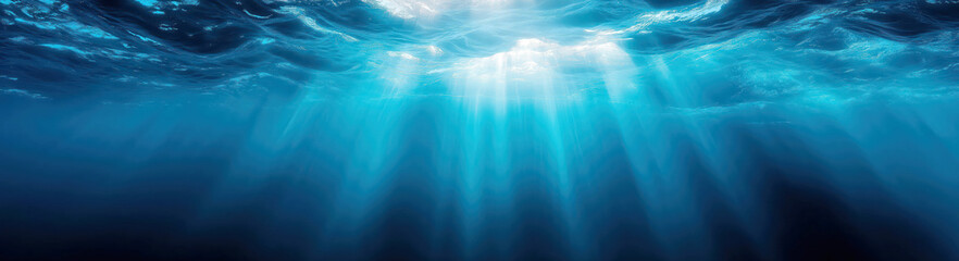 Fototapeta premium blue water at a depth below surface of the sea underwater. sunbeams and tranquility on the natural background of ocean