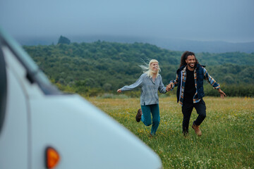 Cute, young couple having fun on a meadow
