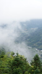 The beautiful mountains landscapes with the green forest and little village as background in the countryside of the China